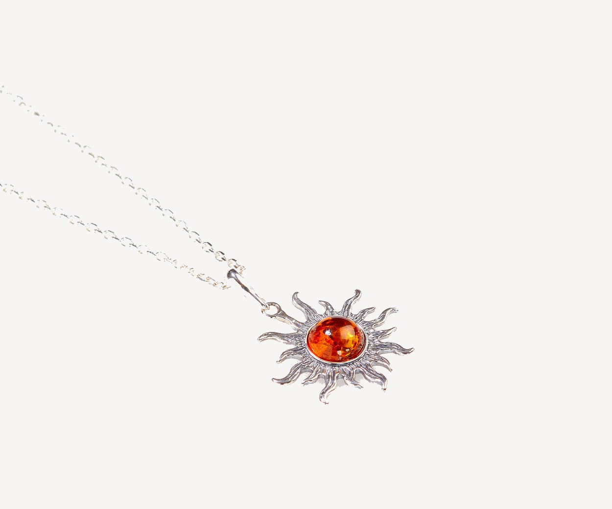 Amber Sun Charm Pendant — Baltic amber and sterling silver jewellery by Baltic Beauty
