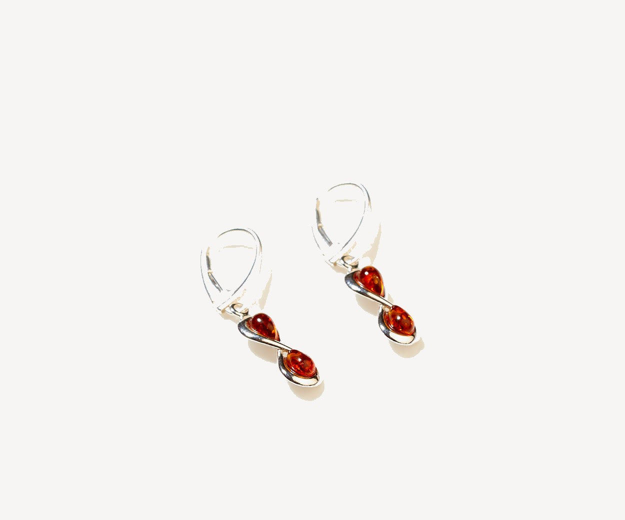 Amber Infinity Drop Earrings – handcrafted in Baltic amber and sterling silver