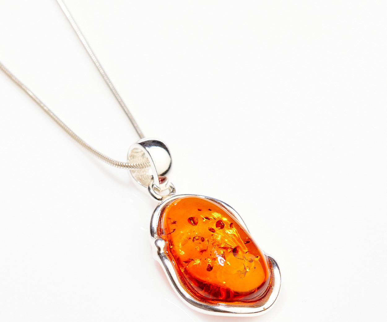 Amber Ripple Pendant Necklace – handcrafted in Baltic amber and sterling silver