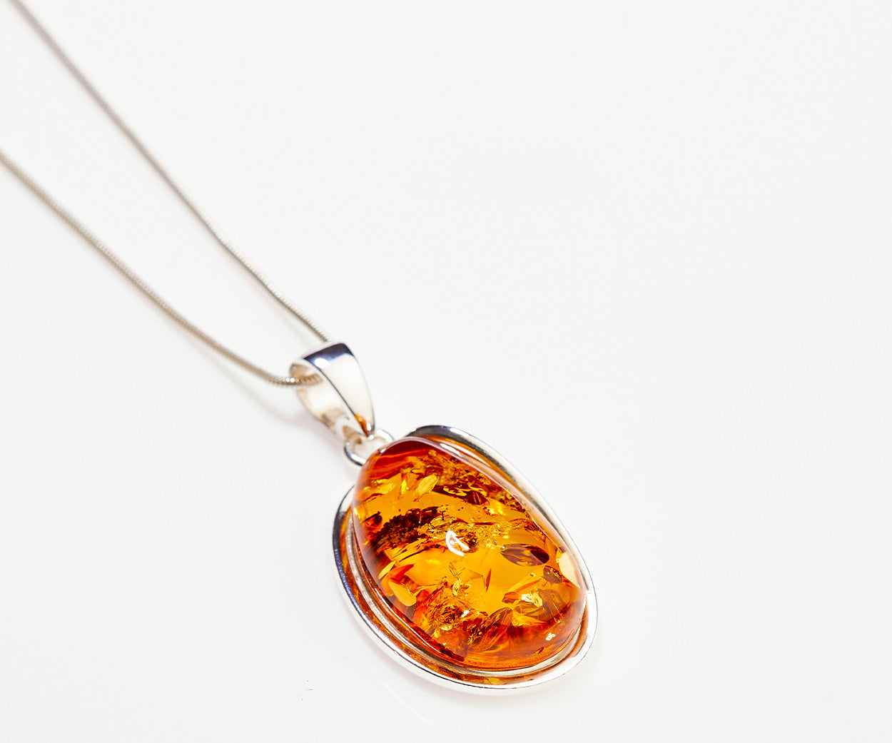 Amber Sunrise Pendant Necklace – handcrafted in Baltic amber and sterling silver