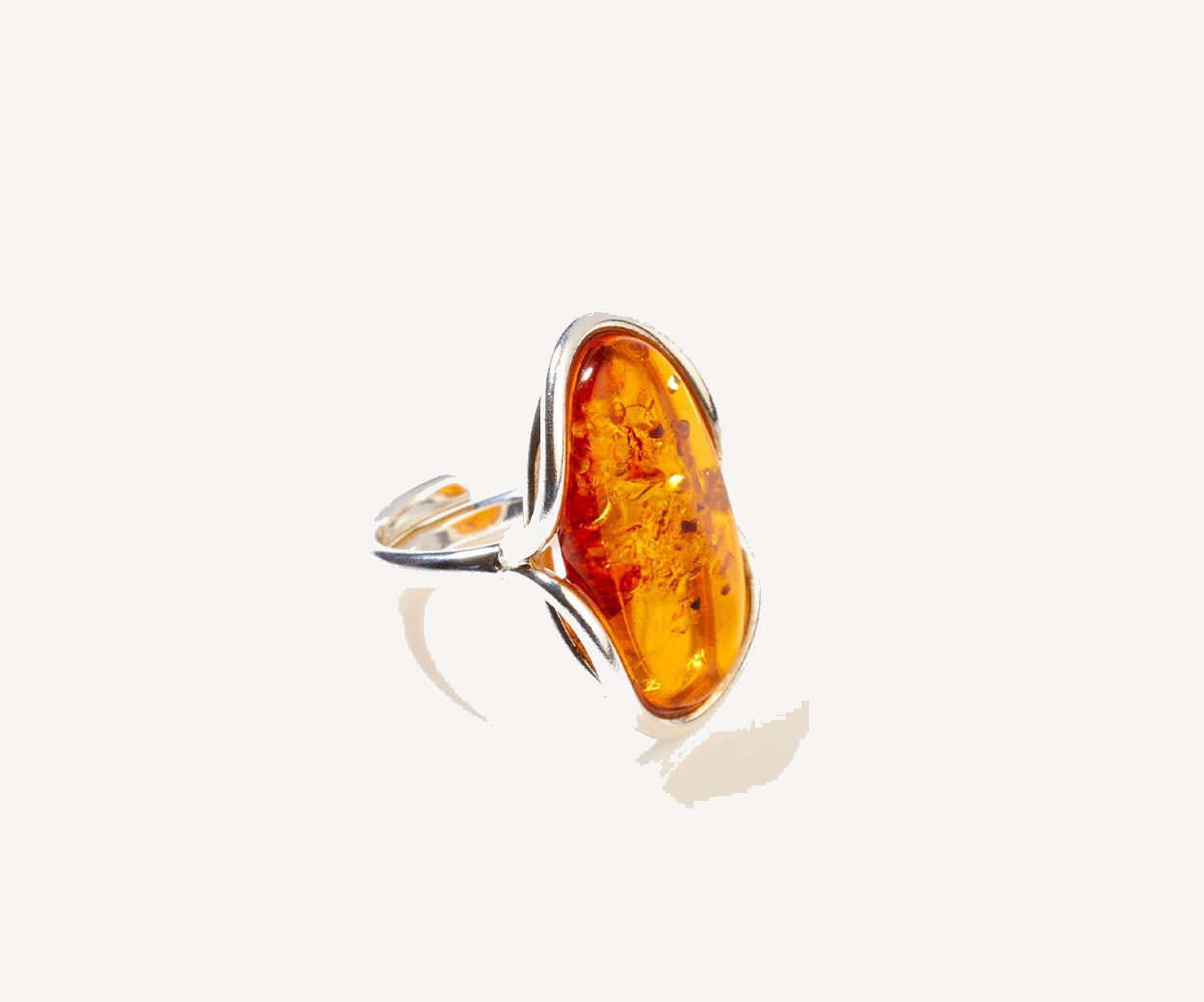 Statement Amber Ripple Ring – handcrafted in Baltic amber and sterling silver