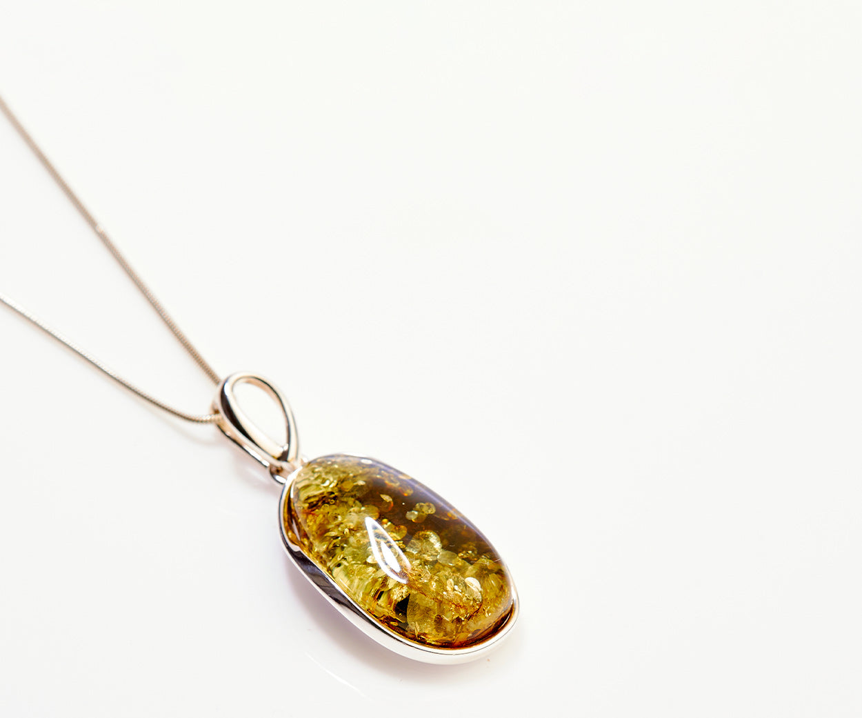 Green Tidal Pendant Necklace – handcrafted in Baltic amber and sterling silver