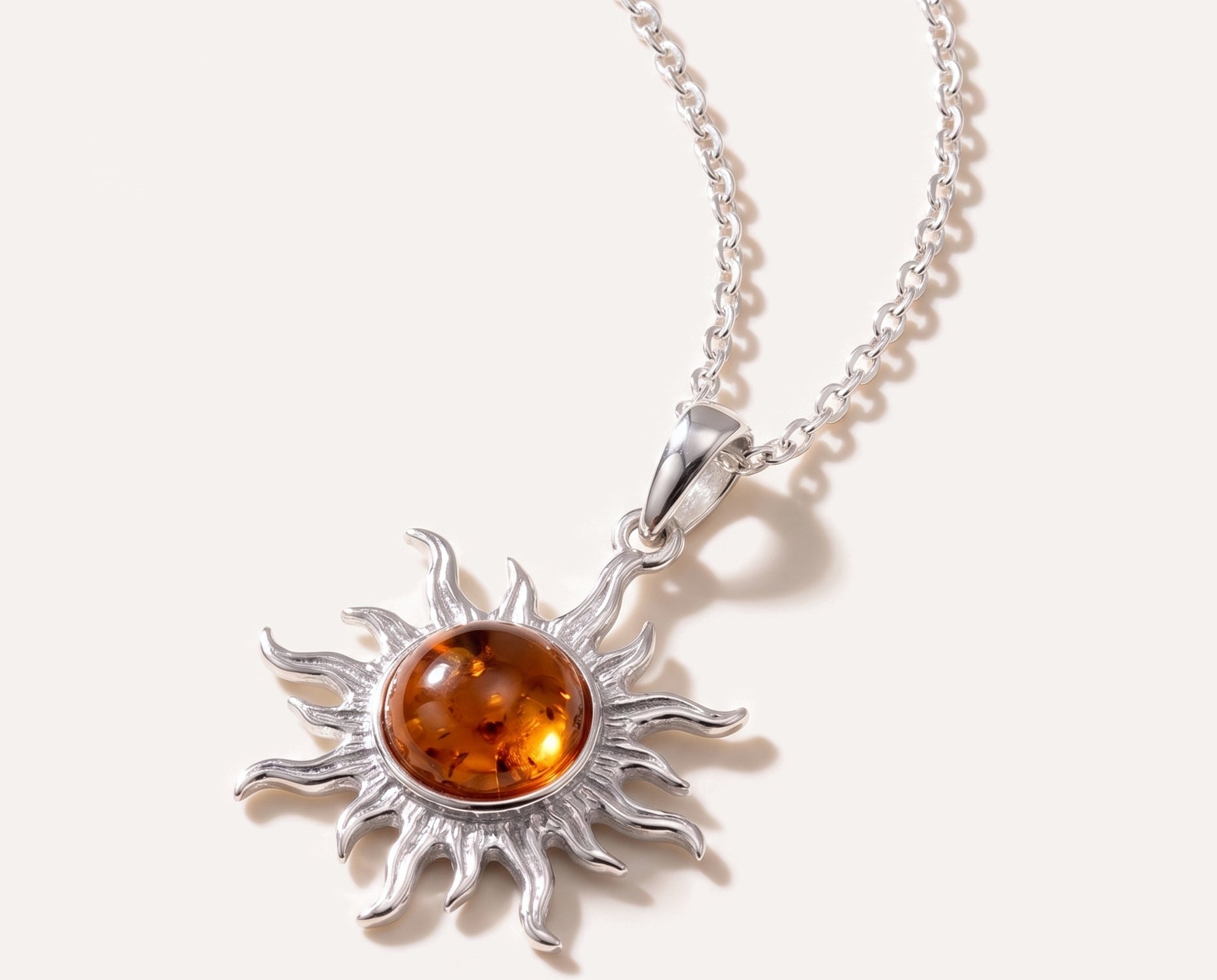 Amber Sun Charm Pendant — Baltic amber and sterling silver jewellery by Baltic Beauty