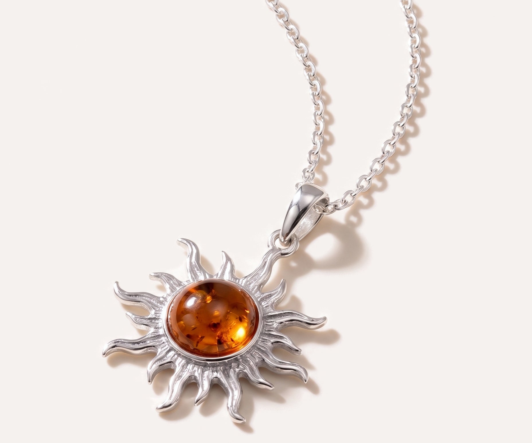 Amber Sun Charm Pendant — Baltic amber and sterling silver jewellery by Baltic Beauty