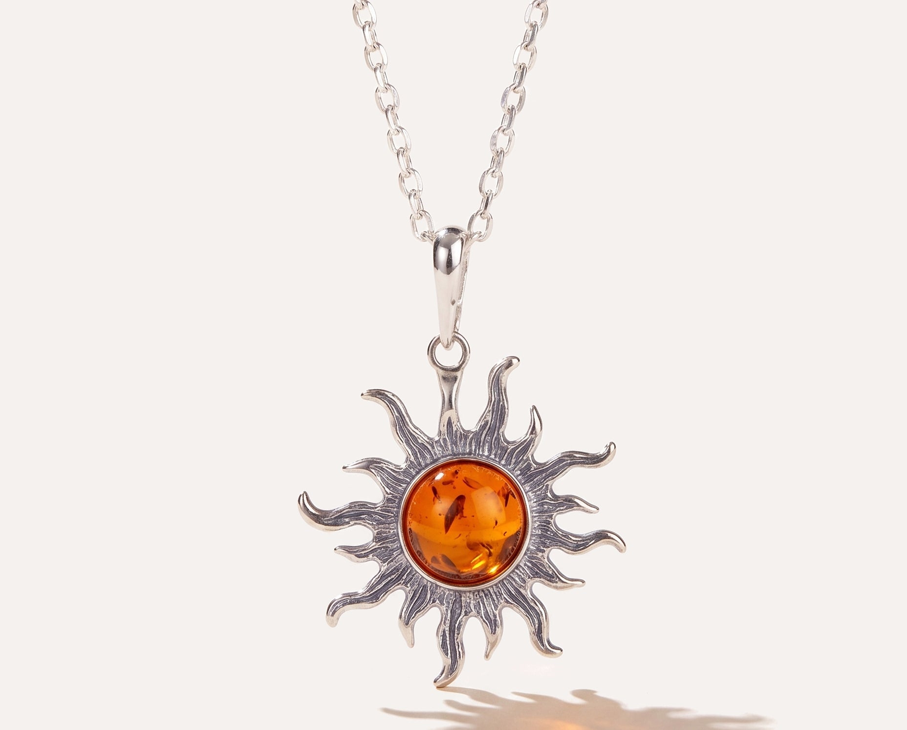Amber Sun Charm Pendant — Baltic amber and sterling silver jewellery by Baltic Beauty