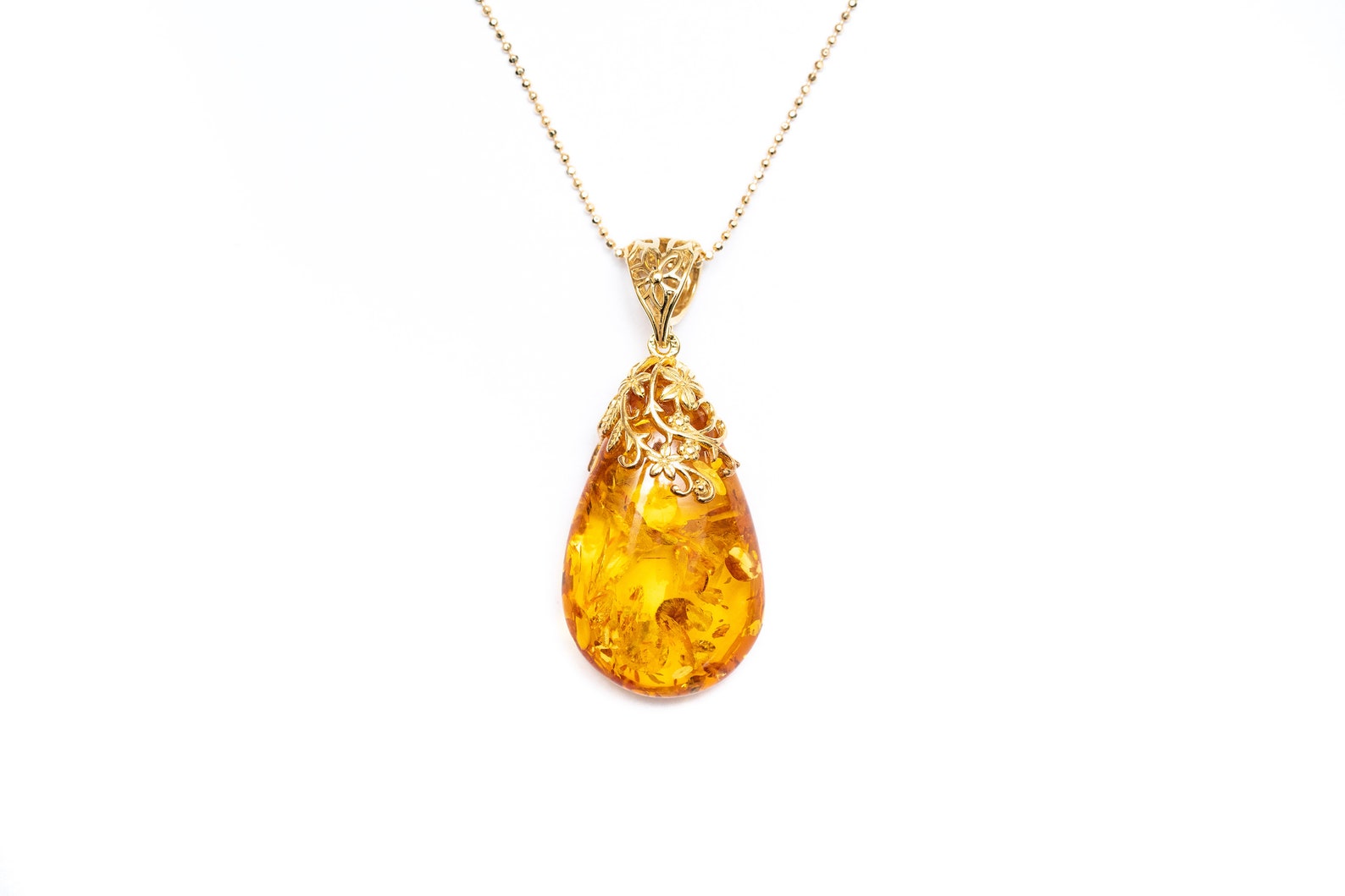 Gold Floral Accent Amber Droplet Pendant- Necklaces- Baltic Beauty